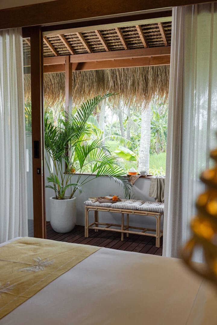 Stunning balcony view overlooking lush greenery at a Bali retreat in Ubud, offering a serene and peaceful atmosphere.