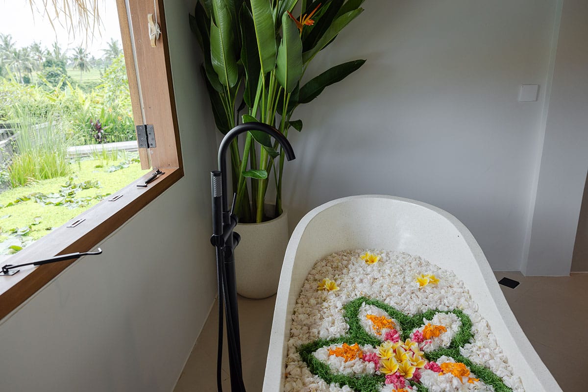 Gaia Room interior at luxury Bali retreat in Ubud – tropical decor, natural wood accents, serene setting, private pool, and signature flower bath experience for a rejuvenating wellness getaway.