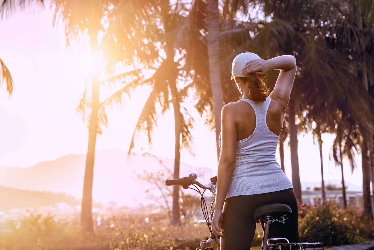 Participants enjoying a scenic bike tour through lush landscapes during a fitness retreat