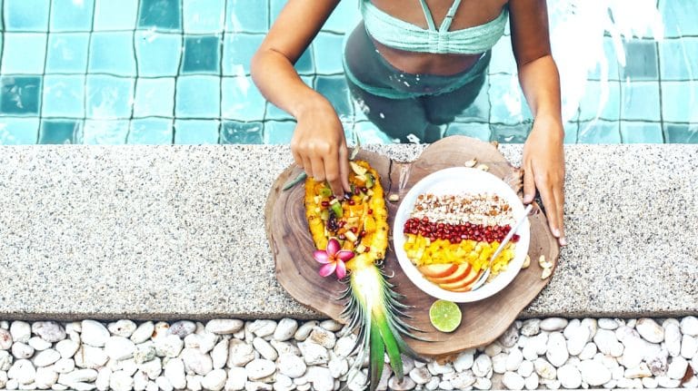 Food_Woman_eating_fruit_smootie_bowl_pool_Health_retreat