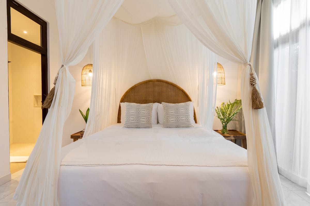 Serene private retreat room in Ubud, ideal for solo travelers, featuring tropical decor and a peaceful ambiance.