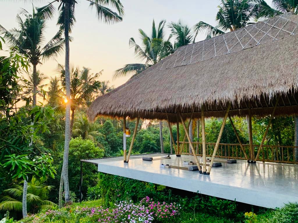 Serene yoga shala surrounded by lush greenery at Ubud Yoga Goddess Retreat, perfect for yoga and wellness practices in Bali.